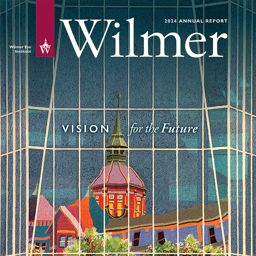 Annual report 2024 cover depicting the Hopkins dome building reflected against the glass exterior of the Wilmer outpatient building
