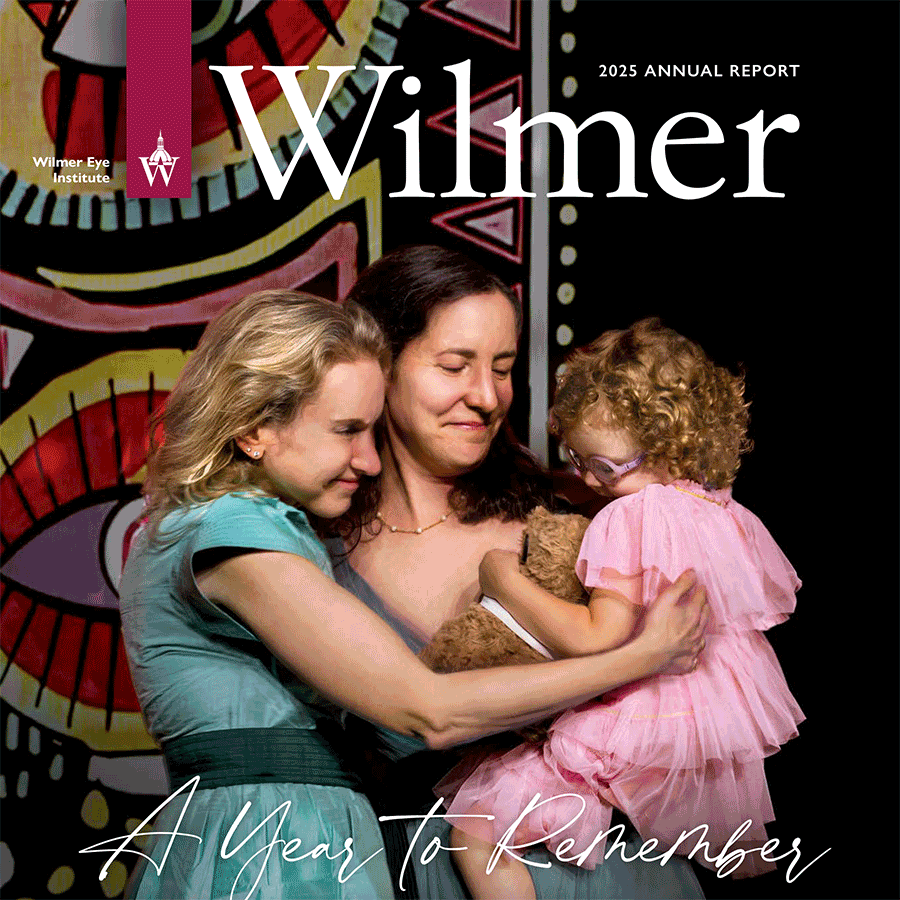 Annual report 2025 cover. Courtney Kraus, Maggie Cowell, Bernie Cowell smiling together at the Centennial gala
