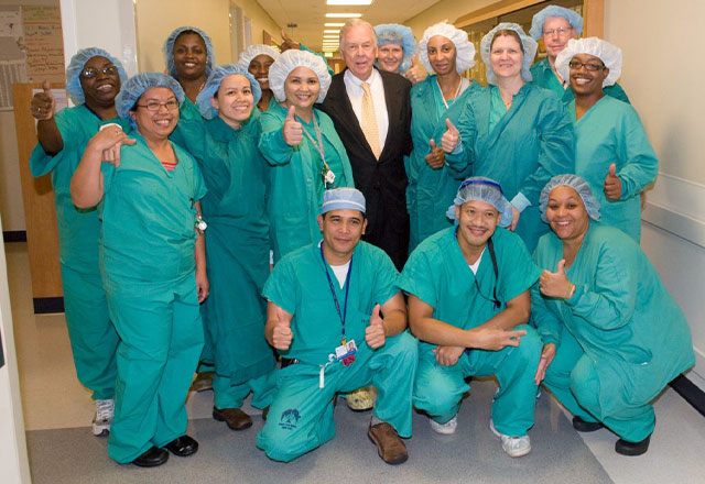 T. Boone Pickens, center, surrounded by Wilmer’s perioperative nurses in 2013