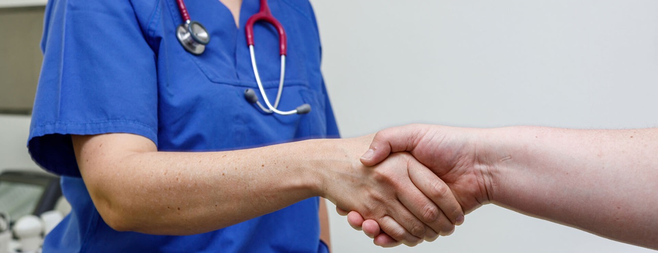 doctor shakes patient hand