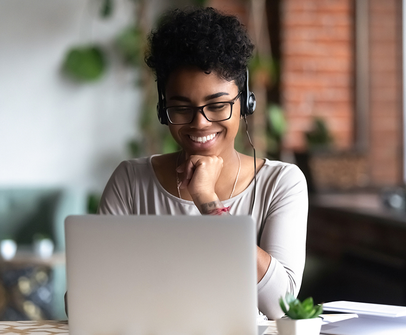 woman takes call on laptop
