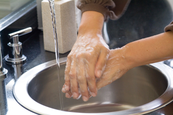 Close up view of hands being washed
