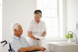 Patient and caregiver in senior home