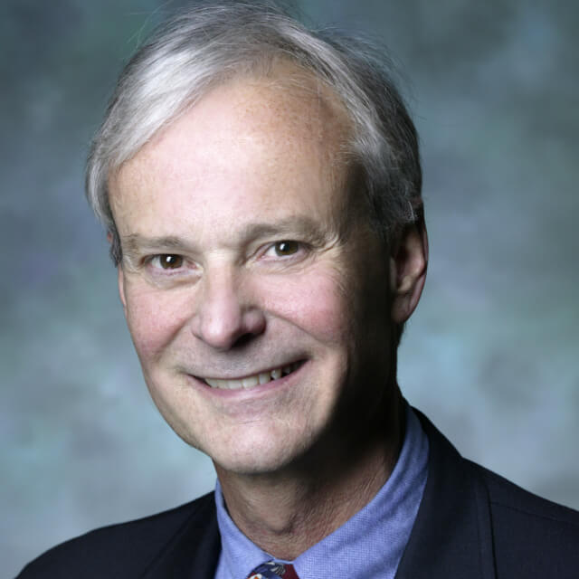 The photo shows E. Robert Feroli.