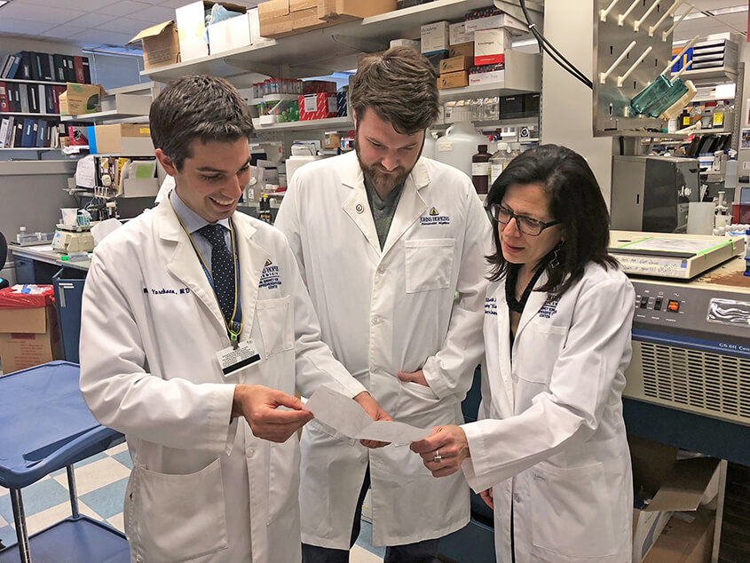Mark Yarchoan, M.D., and Alexander Hopkins, Ph.D., with Elizabeth Jaffee, M.D.