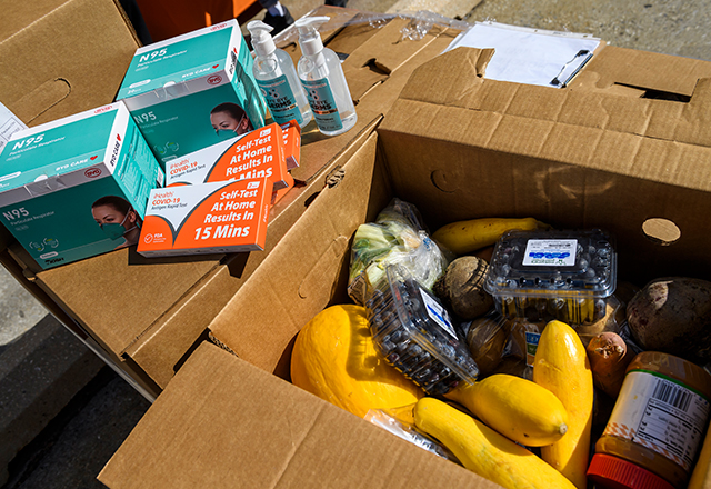 Boxes included food, COVID-19 test kits, N95 masks and hand sanitizer.