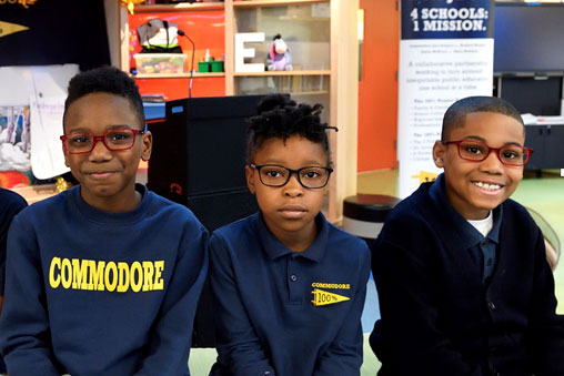 Baltimore City students wearing glasses in the classroom