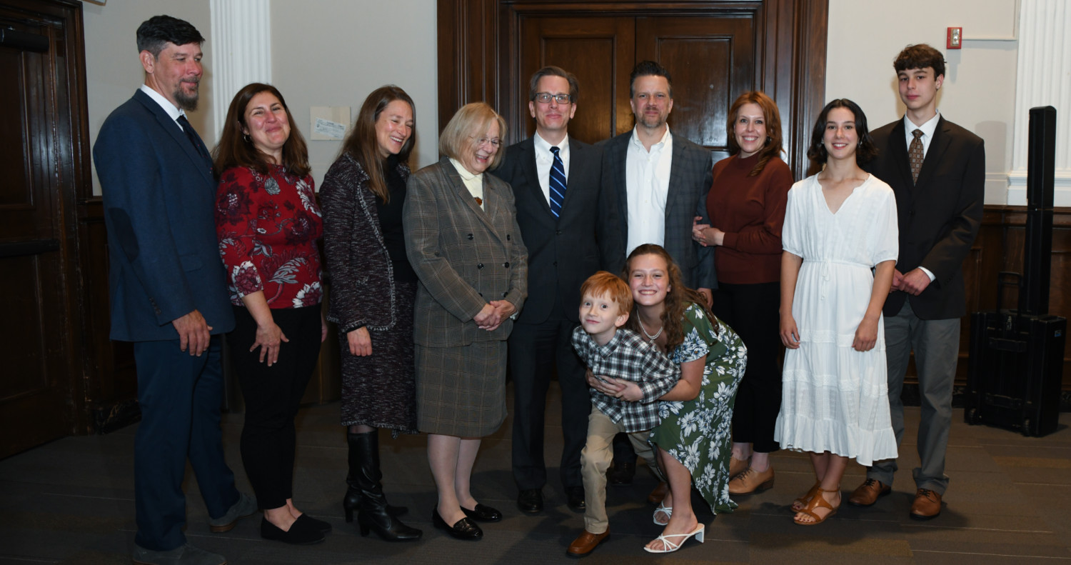 Photo of Andy Ewald surrounded by family and friends at the Virginia DeAcetis Professorship dedication