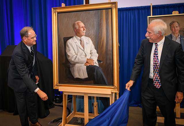 Rothman unveils his portrait.