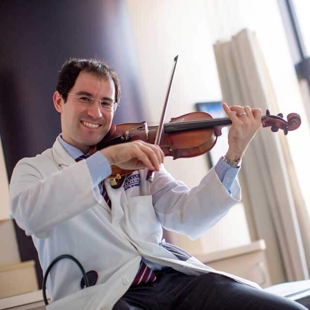 Dr. Alexander Pantelyat playing the violin