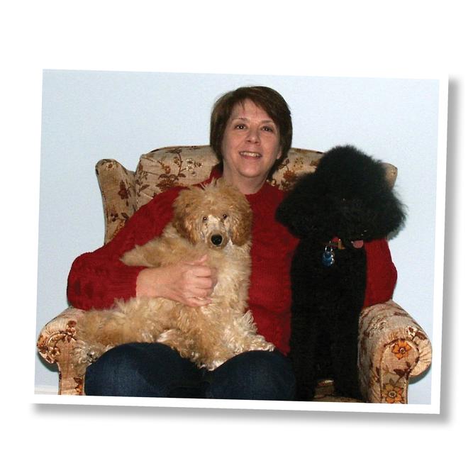 A photo shows Leslie Pfenninger and her dogs. 