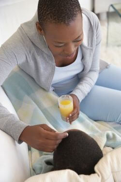 african american woman with orange juice