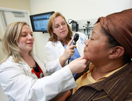 Doctors examining a patient