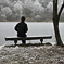 person on bench on a snowy day