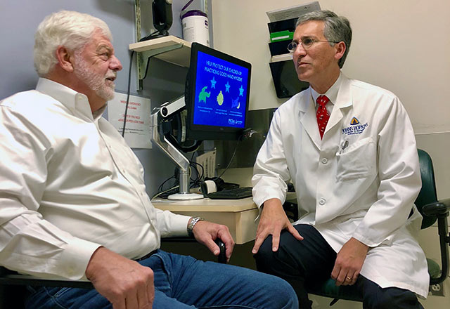 Dr. Maragakis speaking with a patient