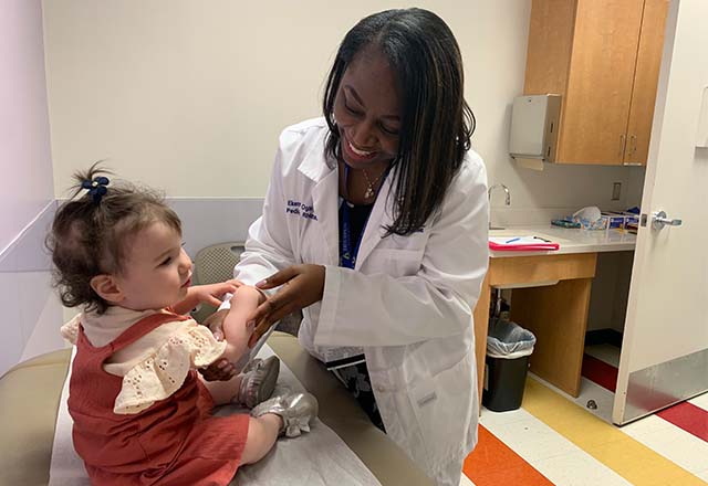 Dr. Ekemini Ogbu and a young patient