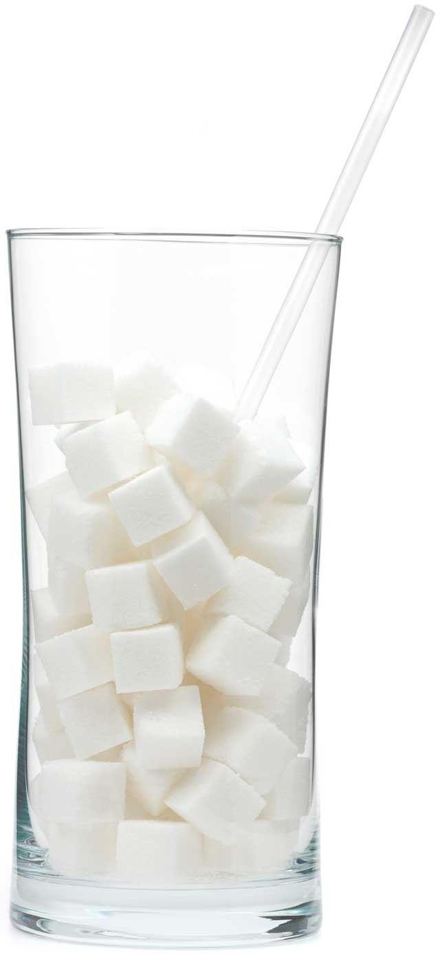 tall glass filled with sugar cubes