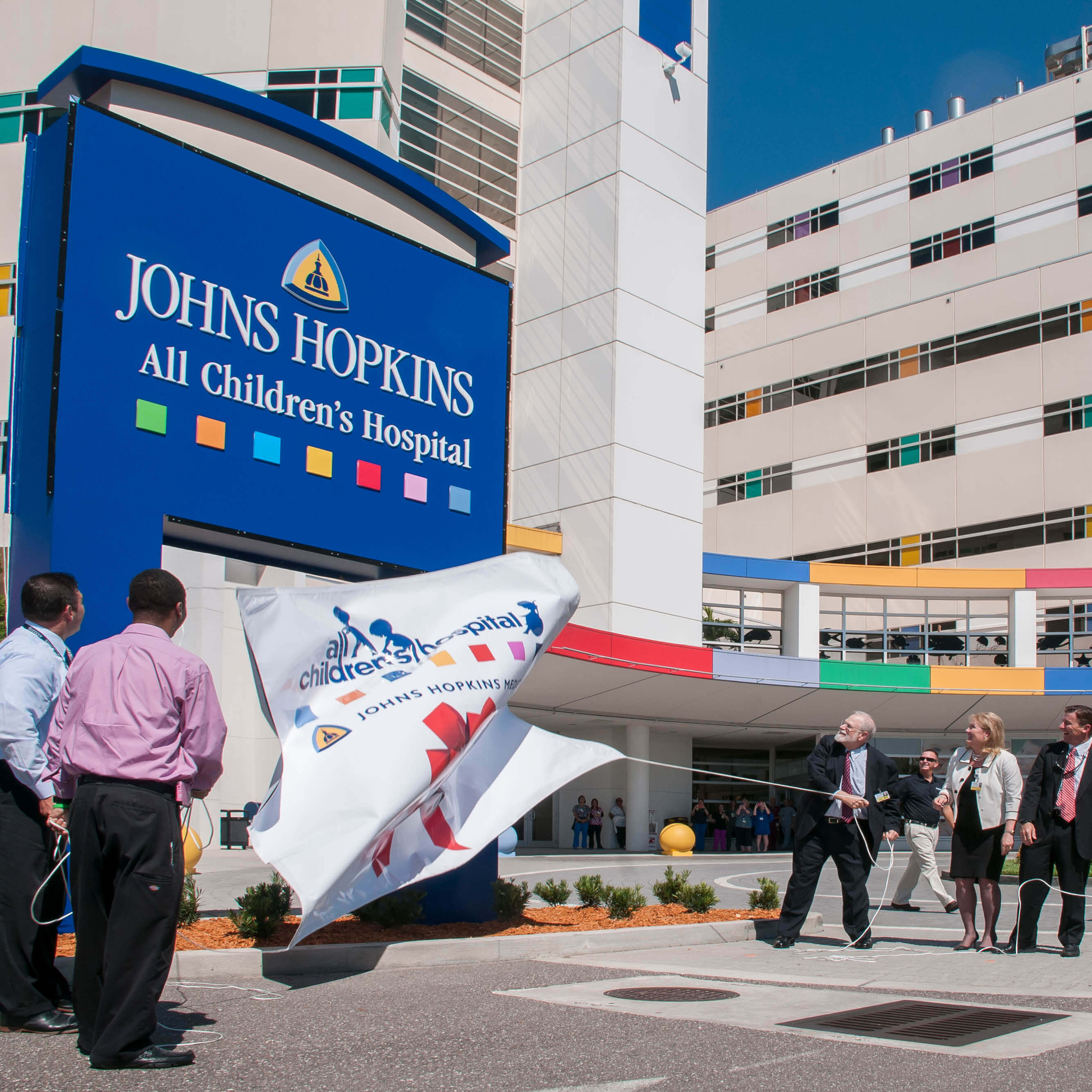 A photo shows the unveiling of the new name of Johns Hopkins All Children's Hospital.