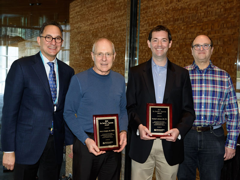 Drs. Thomas Johnson and Harry Quigley accept the Epstein Award