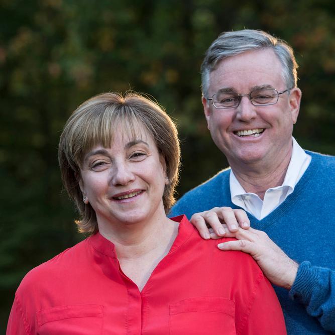 A photo shows June and David Trone.