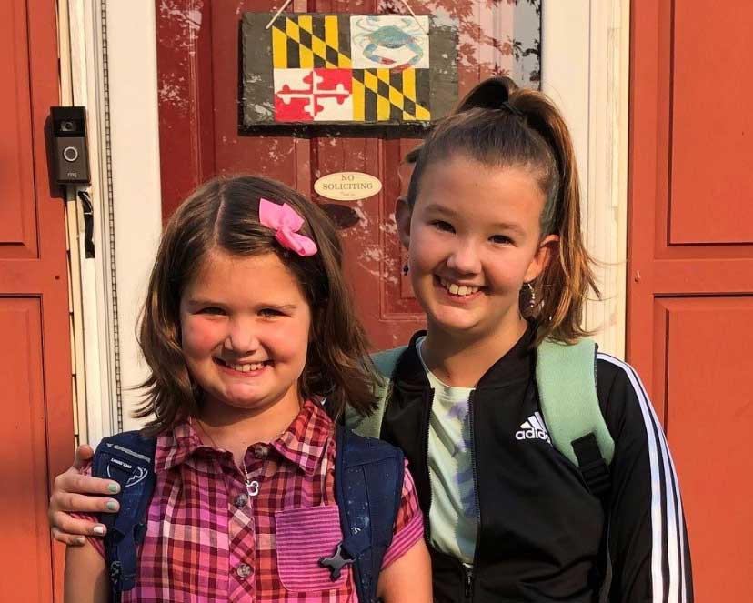 Morgan and her sister take a photo before school