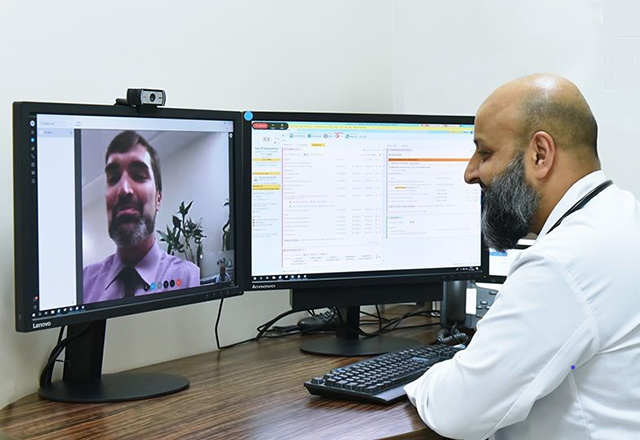 Nisar Yaseen video chats a colleague