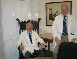 Firm founder Victor McKusick, left, with Steve Achuff, in the Osler Textbook Room.