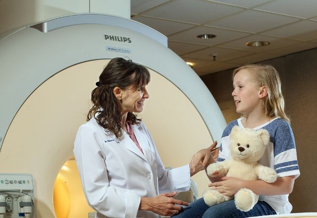 child aged patient talking to radiologist