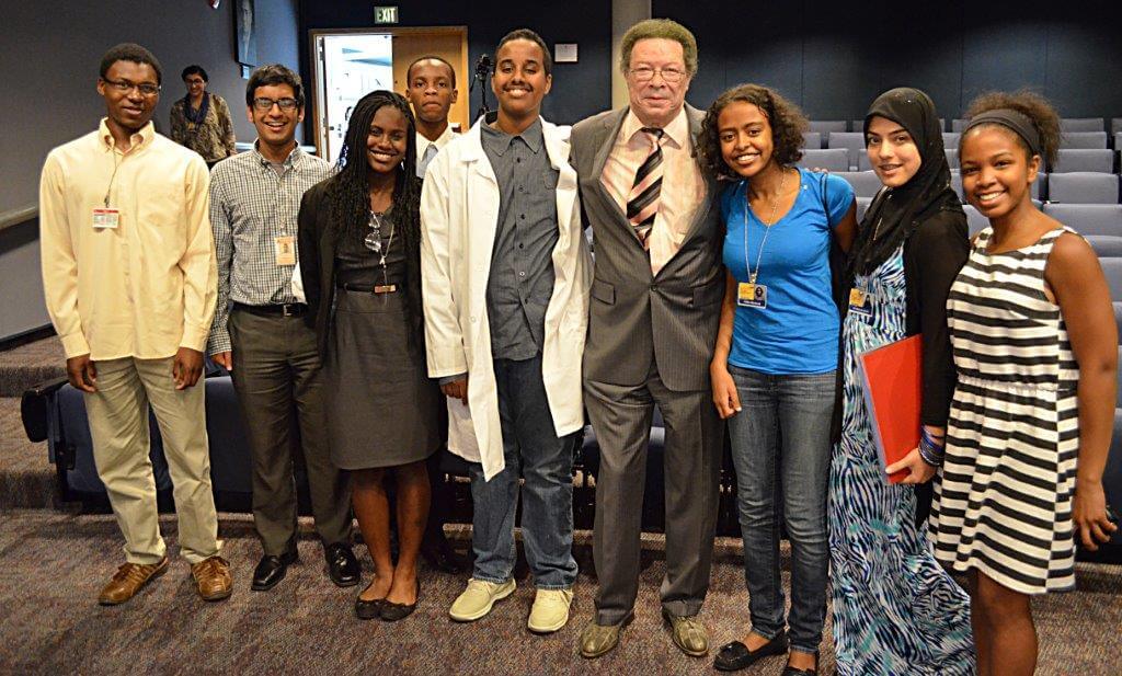 High school students pose with Levi Watkins, M.D.