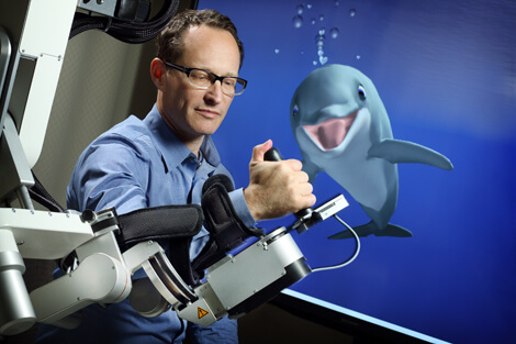 John Krakauer’s lab has created a video game in which players control a neuroscientifically realistic dolphin to improve motor functions in patients recovering from stroke.