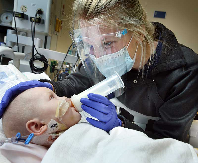 Nurse and baby in the PCICU