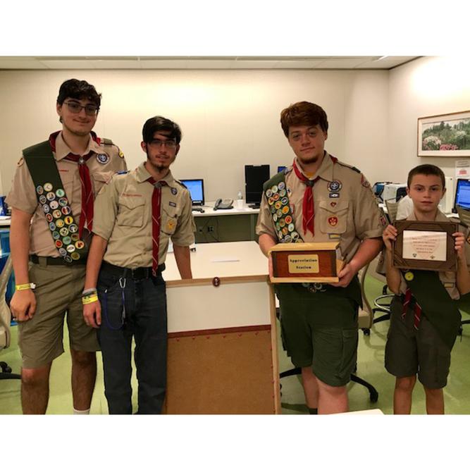 A photo shows Ben Ridenbough and his Eagle Scout group.