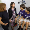 Lisa DeCamp, M.D., discussing healthy habits with Marlene Aza and her sons, Marlon and Angelo