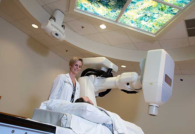 Dr. Redmond with patient and cyberknife 