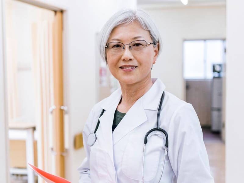 Senior Asian woman doctor in a clinic