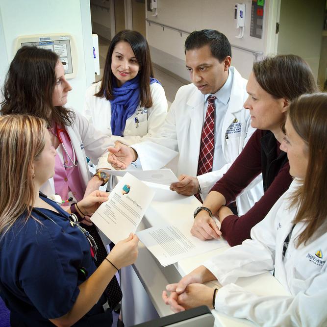 A photo shows members of the Antimicrobial Stewardship Team.