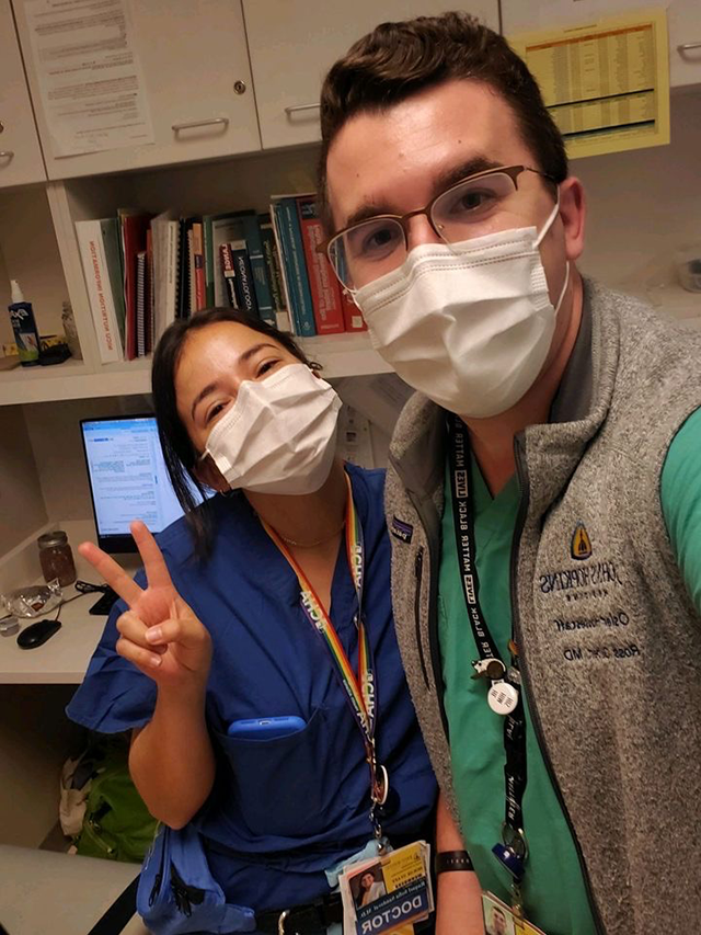 Two residents in masks during clinic.