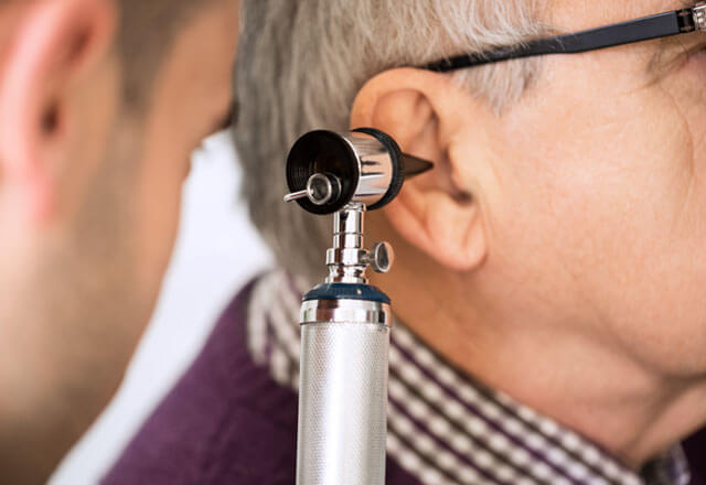 Man undergoing an ear exam