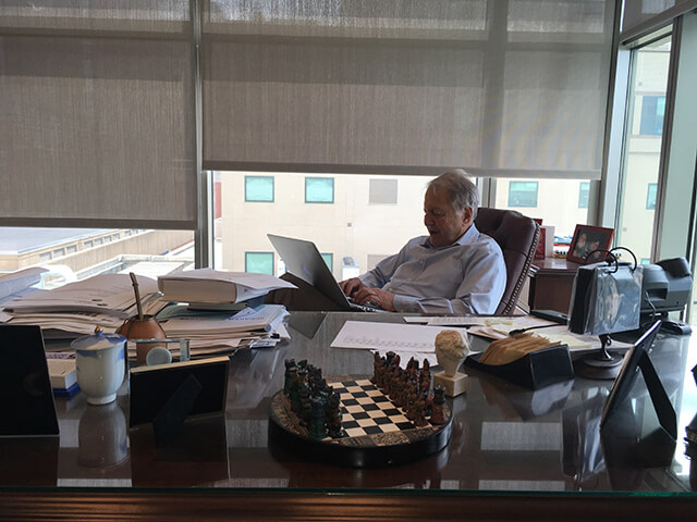Haig Kazazian working in his office