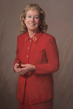 A replica of Julie Freischlag’s portrait hangs in the Alfred Blalock Building lobby.