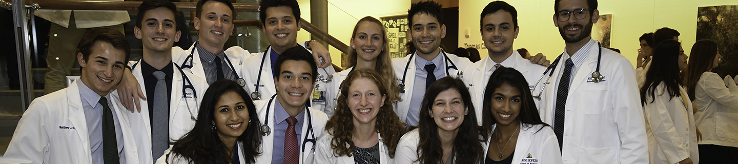 A group of students pose together with their new stethoscopes.