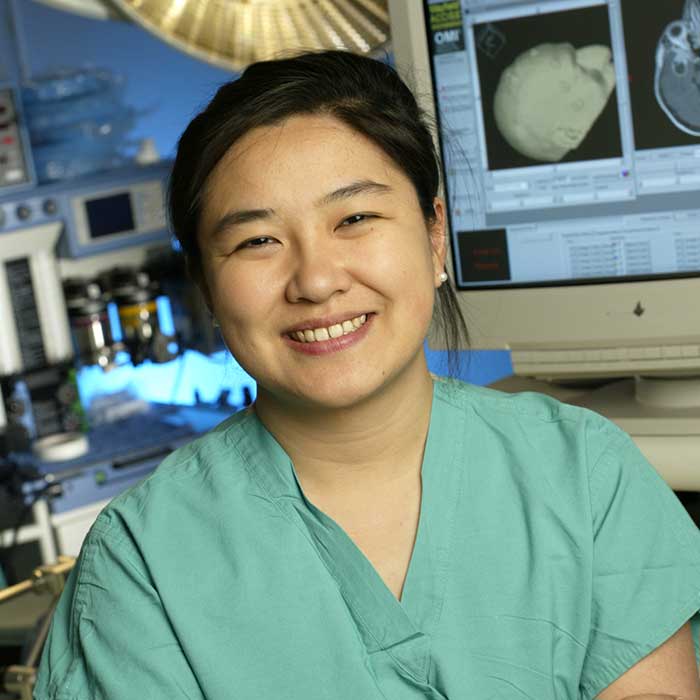 Dr. Huang smiling.