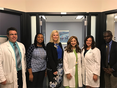 Photo shows members of the Perioperative Pain Clinic team. From left are: pain management doctor Ronen Shechter, clinic coordinator Grace Attwa, clinic administrator Erin Blume, clinic director Marie Hanna, psychiatrist Traci Speed, and vice chair for system integration Kayode Williams. 