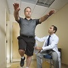 At the NIH Clinical Center, Dr. Christian Shenouda evaluates Joe Posato’s balance