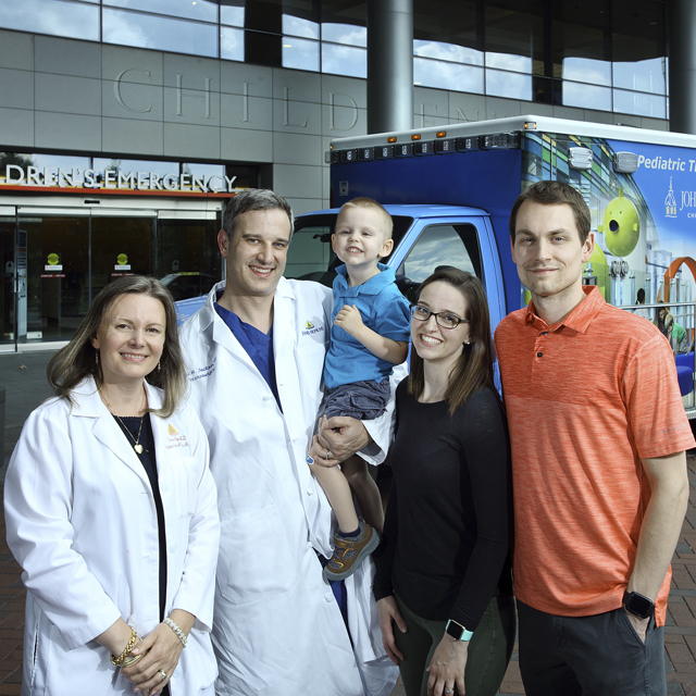 Drs. Jackson and Noje with Timothy and parents.